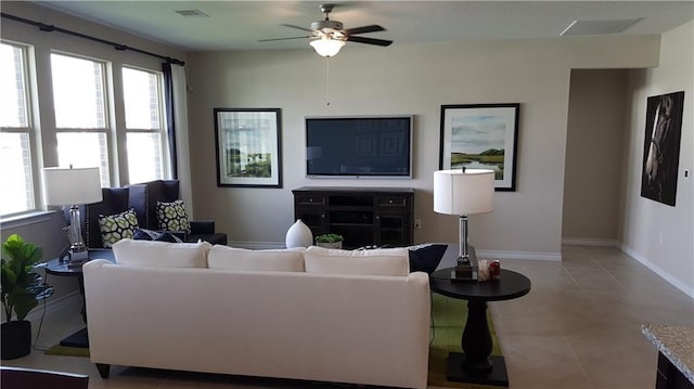 10909 Mickelson Dr, Austin, TX 78747 - living room with a ceiling fan and baseboards