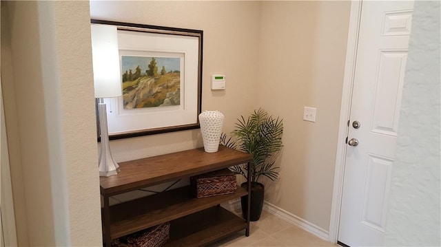 10909 Mickelson Dr, Austin, TX 78747 - entryway with baseboards and light tile patterned floors