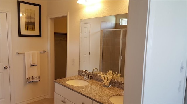 10909 Mickelson Dr, Austin, TX 78747 - full bathroom featuring a stall shower and double vanity