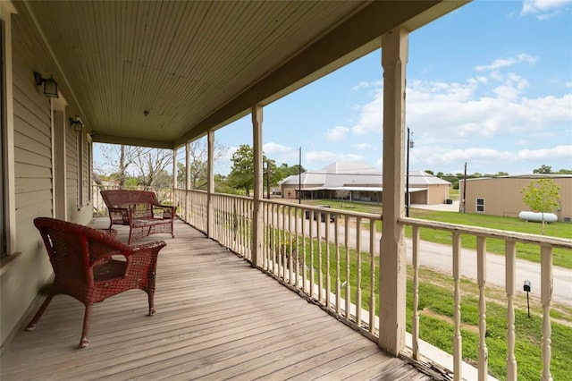 203 Grover St, Ellinger, TX 78938 - wooden porch featuring a yard and a residential view