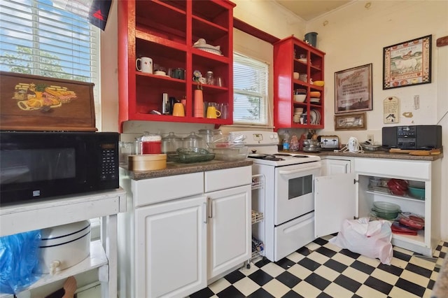203 Grover St, Ellinger, TX 78938 - kitchen with white range with electric cooktop, black microwave, open shelves, and healthy amount of natural light