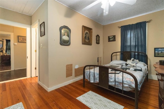 203 Grover St, Ellinger, TX 78938 - bedroom featuring wood finished floors and a ceiling fan