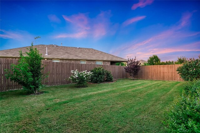 18708 Moreto Loop, Pflugerville, TX 78660 - yard at dusk with a fenced backyard