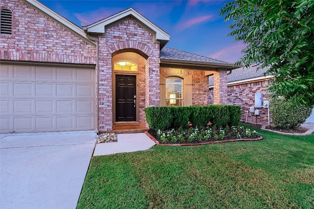 18708 Moreto Loop, Pflugerville, TX 78660 - view of front of property with a yard, brick siding, concrete driveway, a garage, and roof with shingles