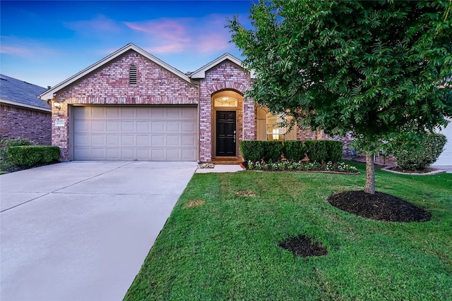 18708 Moreto Loop, Pflugerville, TX 78660 - view of front of property featuring an attached garage, driveway, brick siding, and a lawn