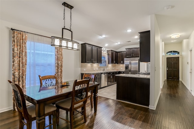 18708 Moreto Loop, Pflugerville, TX 78660 - dining area with wood finished floors, lofted ceiling, and recessed lighting
