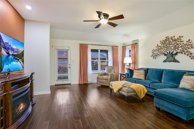 18708 Moreto Loop, Pflugerville, TX 78660 - living room with ceiling fan, dark wood-style floors, recessed lighting, and a glass covered fireplace