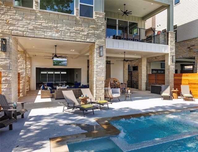563 Ellen Williams Loop, Kingsland, TX 78639 - back of house featuring ceiling fan and stone siding