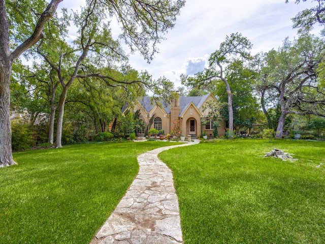 2611 Woodmont Ave, Austin, TX 78703 - tudor house featuring a front lawn and stone siding