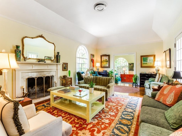 2611 Woodmont Ave, Austin, TX 78703 - living room featuring wood finished floors, a fireplace, and vaulted ceiling