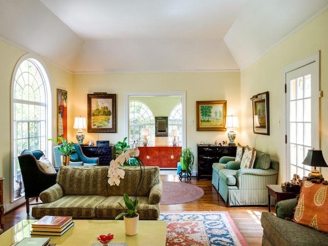 2611 Woodmont Ave, Austin, TX 78703 - living room featuring vaulted ceiling, healthy amount of natural light, wood finished floors, and crown molding