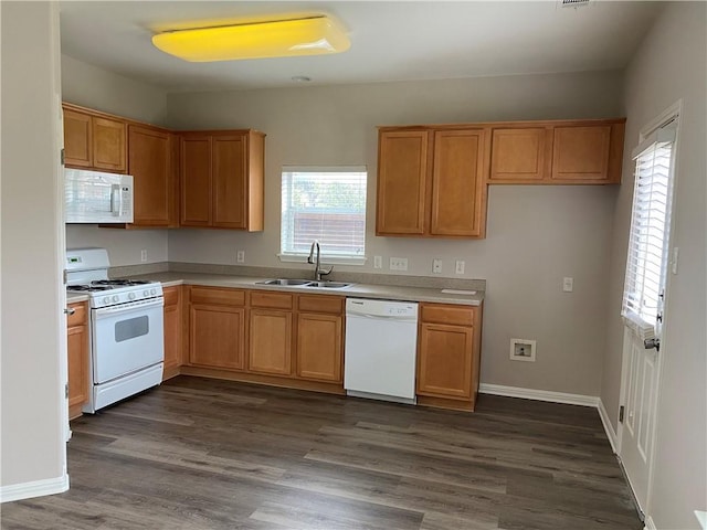 2700 Saddle Blanket Pl, Leander, TX 78641 - kitchen with white appliances, light countertops, and dark wood finished floors