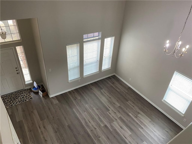 2700 Saddle Blanket Pl, Leander, TX 78641 - foyer featuring a chandelier, dark wood finished floors, and a towering ceiling