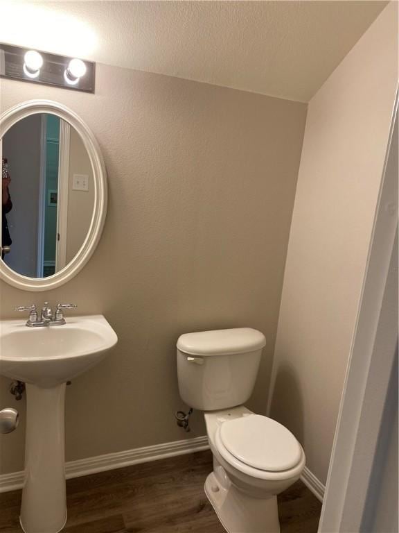 2700 Saddle Blanket Pl, Leander, TX 78641 - half bath with toilet and wood finished floors