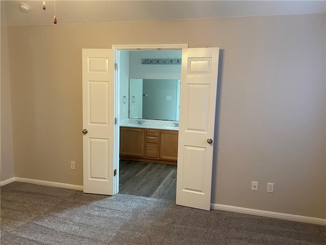 2700 Saddle Blanket Pl, Leander, TX 78641 - unfurnished bedroom with dark colored carpet and baseboards