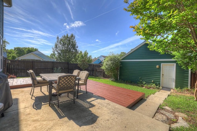 201 Trestle Tree, San Marcos, TX 78666 - fenced backyard featuring outdoor dining area, a deck, and a patio area
