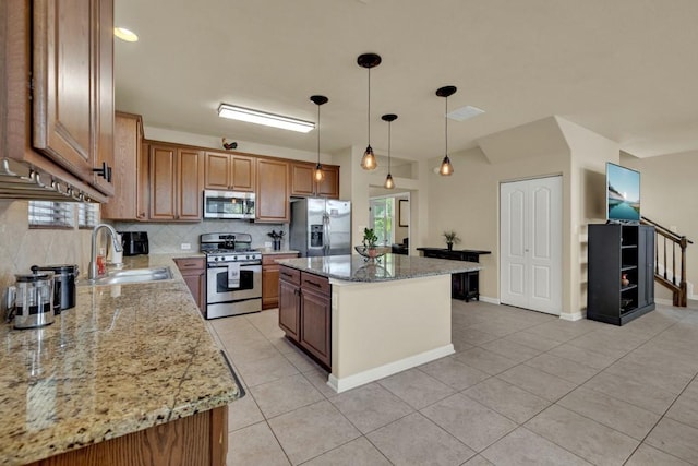 201 Trestle Tree, San Marcos, TX 78666 - kitchen featuring stainless steel appliances, backsplash, light tile patterned flooring, and a kitchen island