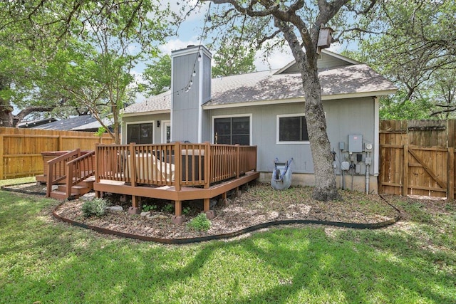 9100 Bill Hickcock Pass, Austin, TX 78748 - back of property with a fenced backyard, a wooden deck, a shingled roof, and a chimney