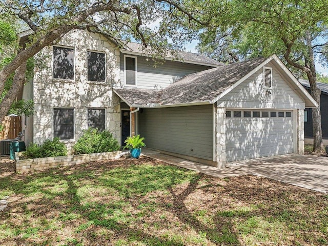 9100 Bill Hickcock Pass, Austin, TX 78748 - traditional-style house with an attached garage, driveway, roof with shingles, and stone siding