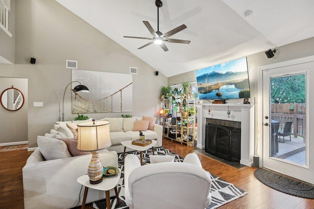 9100 Bill Hickcock Pass, Austin, TX 78748 - living area with a ceiling fan, wood finished floors, a fireplace with flush hearth, and high vaulted ceiling