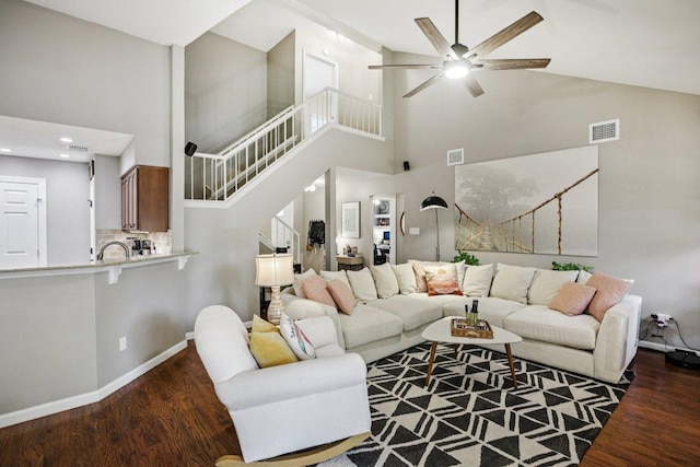 9100 Bill Hickcock Pass, Austin, TX 78748 - living area featuring stairs, ceiling fan, high vaulted ceiling, wood finished floors, and recessed lighting