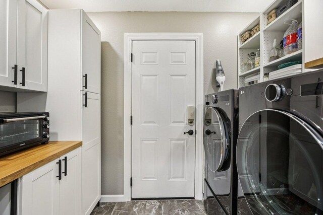 9100 Bill Hickcock Pass, Austin, TX 78748 - laundry room with separate washer and dryer, cabinet space, and dark marble finish flooring