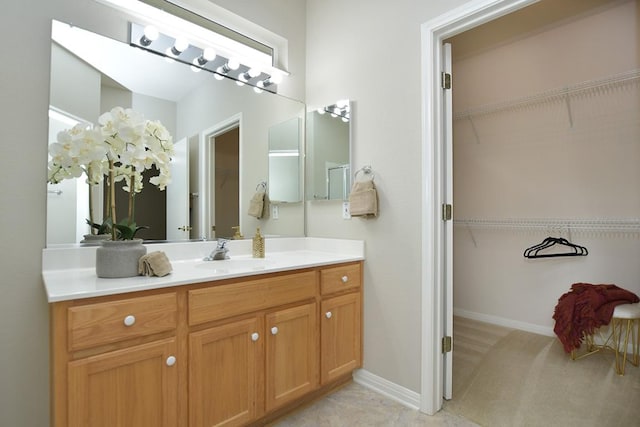 101 Ranch House Cv, Georgetown, TX 78633 - bathroom with vanity and a walk in closet