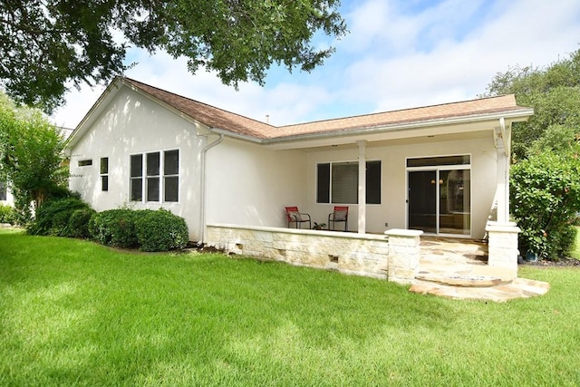 101 Ranch House Cv, Georgetown, TX 78633 - rear view of house featuring a yard, stucco siding, and a porch