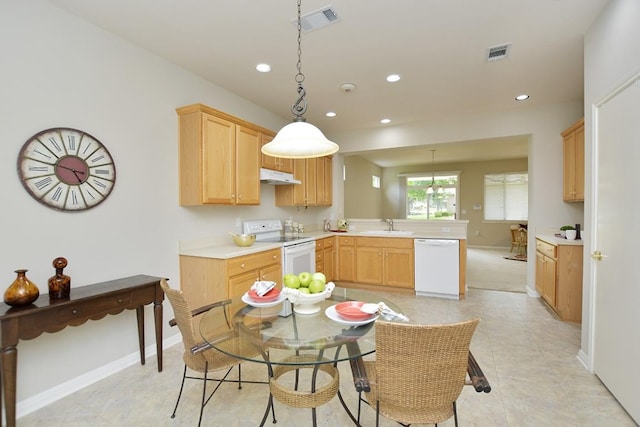 101 Ranch House Cv, Georgetown, TX 78633 - kitchen with white appliances, under cabinet range hood, a peninsula, light countertops, and recessed lighting