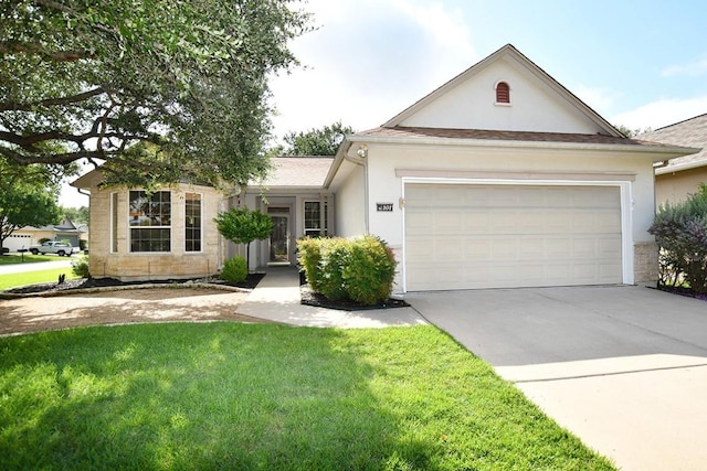 101 Ranch House Cv, Georgetown, TX 78633 - ranch-style house featuring driveway, a garage, a front yard, and stucco siding