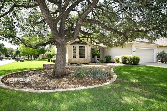 101 Ranch House Cv, Georgetown, TX 78633 - obstructed view of property with a front yard, an attached garage, and stucco siding