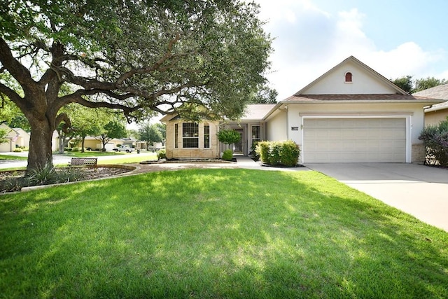 101 Ranch House Cv, Georgetown, TX 78633 - view of front of house with an attached garage, concrete driveway, a front yard, and stucco siding