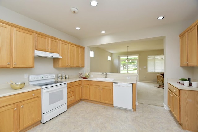101 Ranch House Cv, Georgetown, TX 78633 - kitchen with white appliances, under cabinet range hood, a peninsula, light countertops, and recessed lighting