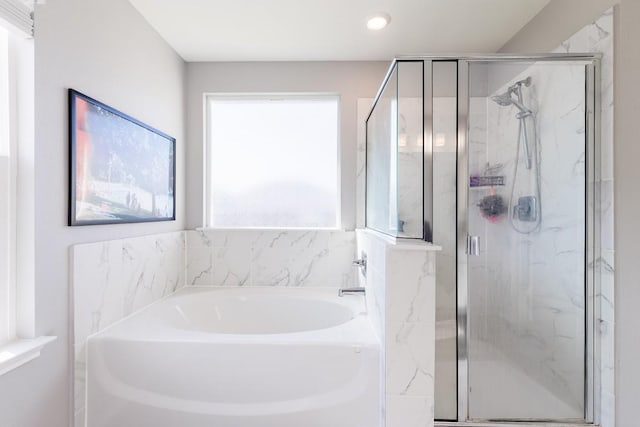 1805 Bogata Ln, Leander, TX 78641 - bathroom with a garden tub, a marble finish shower, and recessed lighting