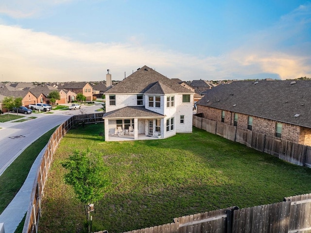 1805 Bogata Ln, Leander, TX 78641 - rear view of property with a residential view, a patio area, and a fenced backyard