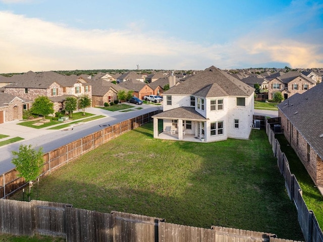 1805 Bogata Ln, Leander, TX 78641 - rear view of house featuring a residential view, a patio, and a fenced backyard