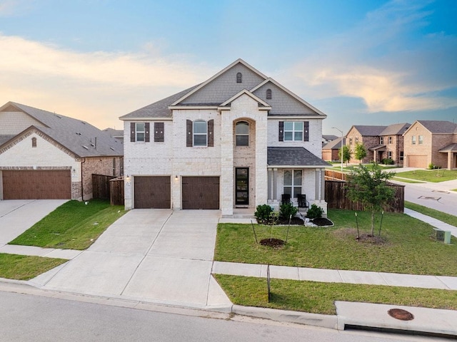 1805 Bogata Ln, Leander, TX 78641 - view of front of property featuring driveway, brick siding, and a garage