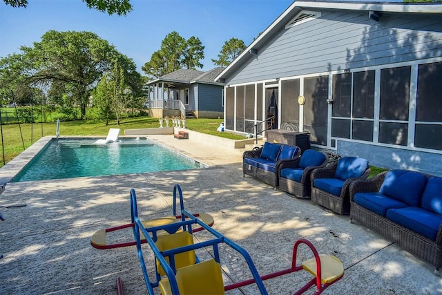 569 Mcallister Rd, Bastrop, TX 78602 - swimming pool with an outdoor living space, a patio, and a sunroom