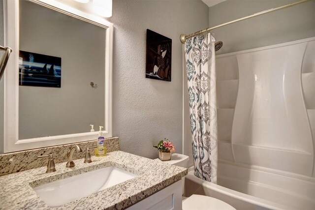 569 Mcallister Rd, Bastrop, TX 78602 - full bathroom with vanity, shower / tub combo, and a textured wall
