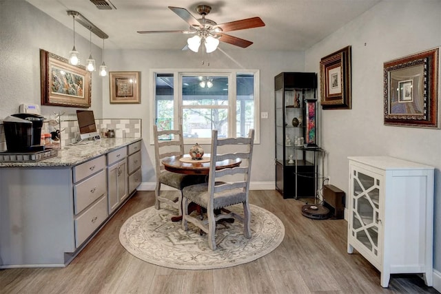569 Mcallister Rd, Bastrop, TX 78602 - dining space with wood finished floors and ceiling fan
