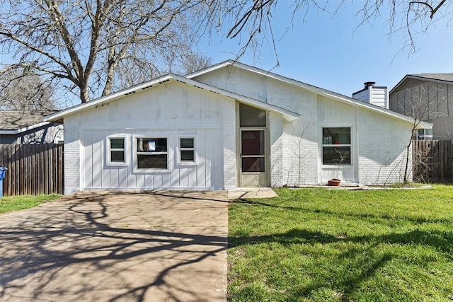 3810 Leafield Dr, Austin, TX 78749 - view of front of house with brick siding, a chimney, and concrete driveway