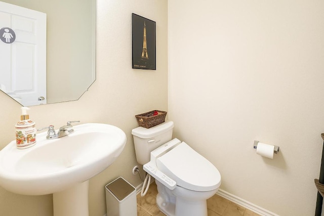 16021 Remington Reserve Way, Austin, TX 78728 - half bath featuring toilet and tile patterned flooring