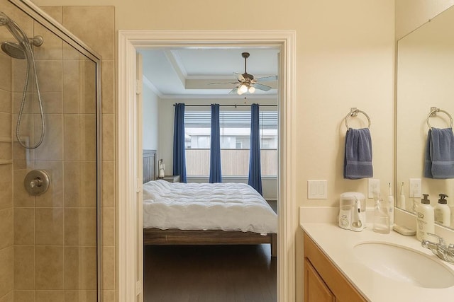 16021 Remington Reserve Way, Austin, TX 78728 - ensuite bathroom featuring crown molding, vanity, tiled shower, and a ceiling fan