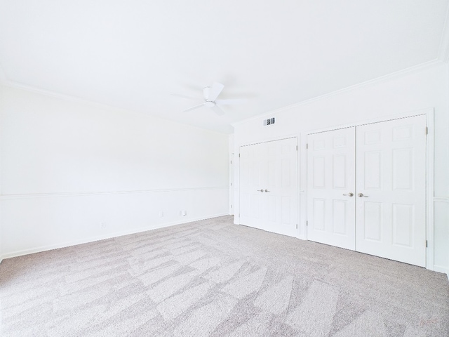 1501 Barton Springs Rd Unit 222, Austin, TX 78704 - unfurnished bedroom featuring crown molding, carpet, multiple closets, and a ceiling fan