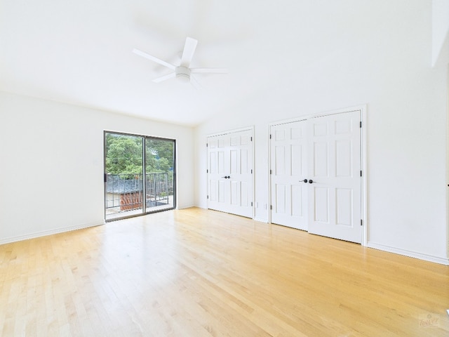 1501 Barton Springs Rd Unit 222, Austin, TX 78704 - unfurnished bedroom with access to outside, light wood-style flooring, multiple closets, a ceiling fan, and high vaulted ceiling