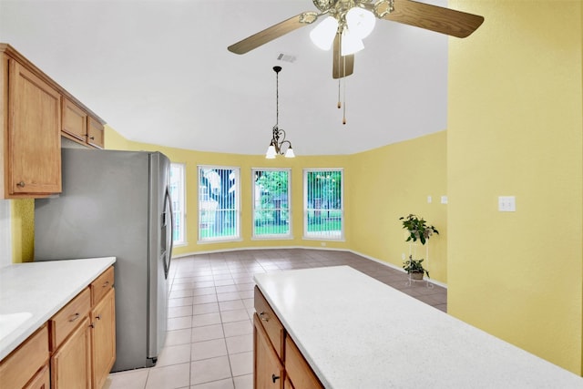 606 Dundalk Bay Cv, Pflugerville, TX 78660 - kitchen featuring stainless steel refrigerator with ice dispenser, light tile patterned floors, light countertops, ceiling fan, and open floor plan
