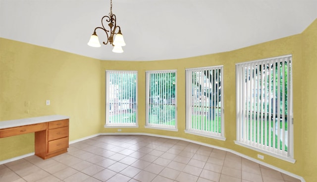 606 Dundalk Bay Cv, Pflugerville, TX 78660 - unfurnished dining area with light tile patterned floors and a chandelier