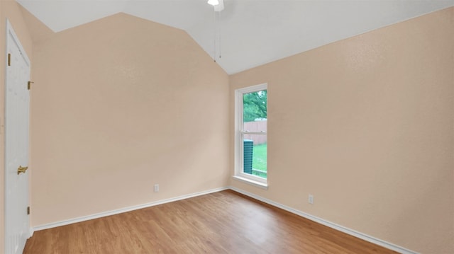606 Dundalk Bay Cv, Pflugerville, TX 78660 - unfurnished room featuring wood finished floors and vaulted ceiling