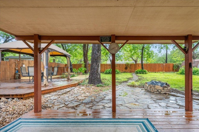 601 Robin Nest, Canyon Lake, TX 78133 - fenced backyard with a gazebo, an outdoor fire pit, and a deck