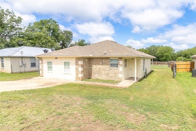 706 Brown St, Lampasas, TX 76550 - back of house with brick siding and roof with shingles